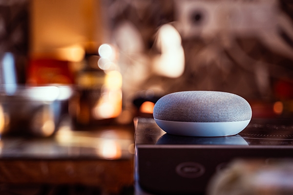 voice search device on tabletop inside of a restaurant setting.