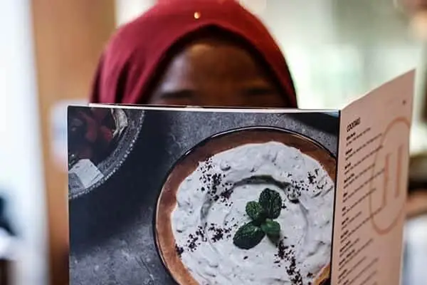person reading a restaurant menu