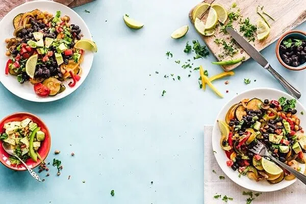 fresh food on a cutting board and served on plates