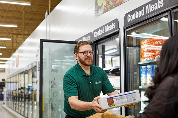 chef'store employee in freezer section