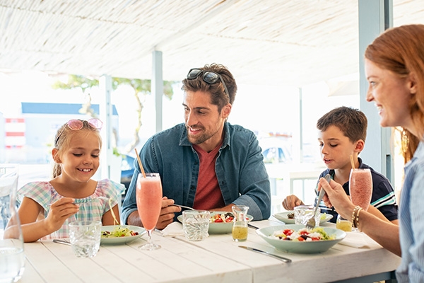 family eating together at restaurant.