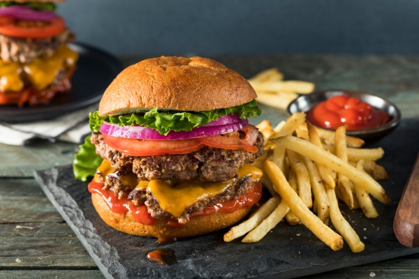 Burger on plate at restaurant.