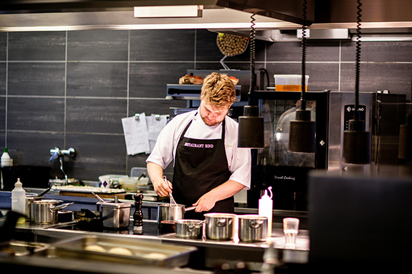 chef cooking in commercial kitchen