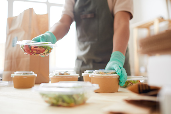 restaurant worker organizing delivery purchases