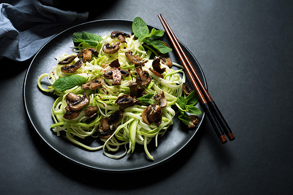 plate of zucchini noodles with healthy toppings