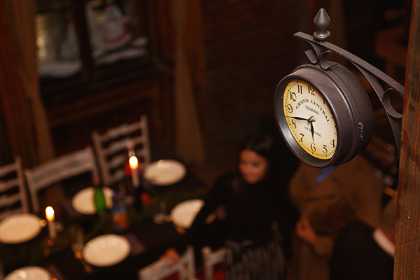 restaurant clock next to people dining