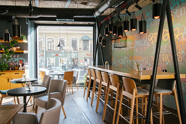Tables and chairs arranged inside a restaurant dining room.