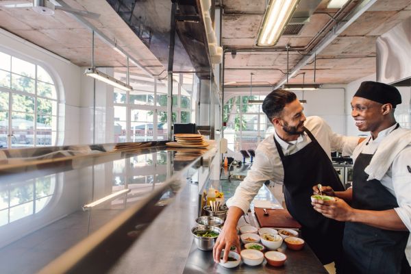 restaurant chef with staff preparing orders