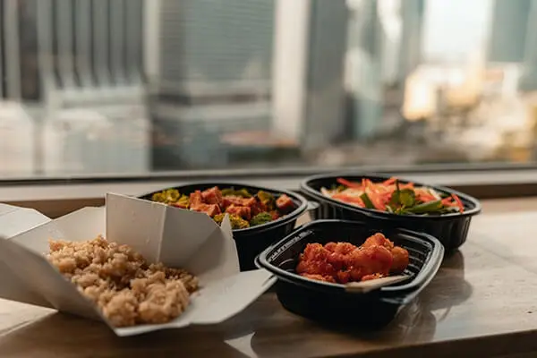 Take out containers with food.