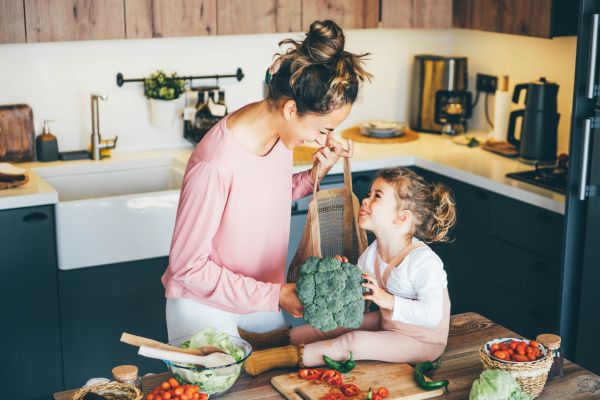 mother and daughter unloading groceries