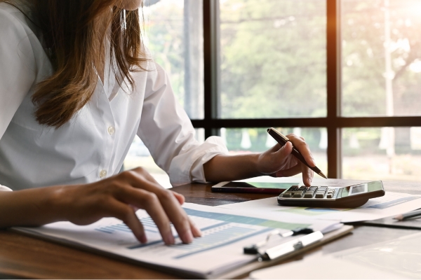Female restaurant owner working on restaurant finances.